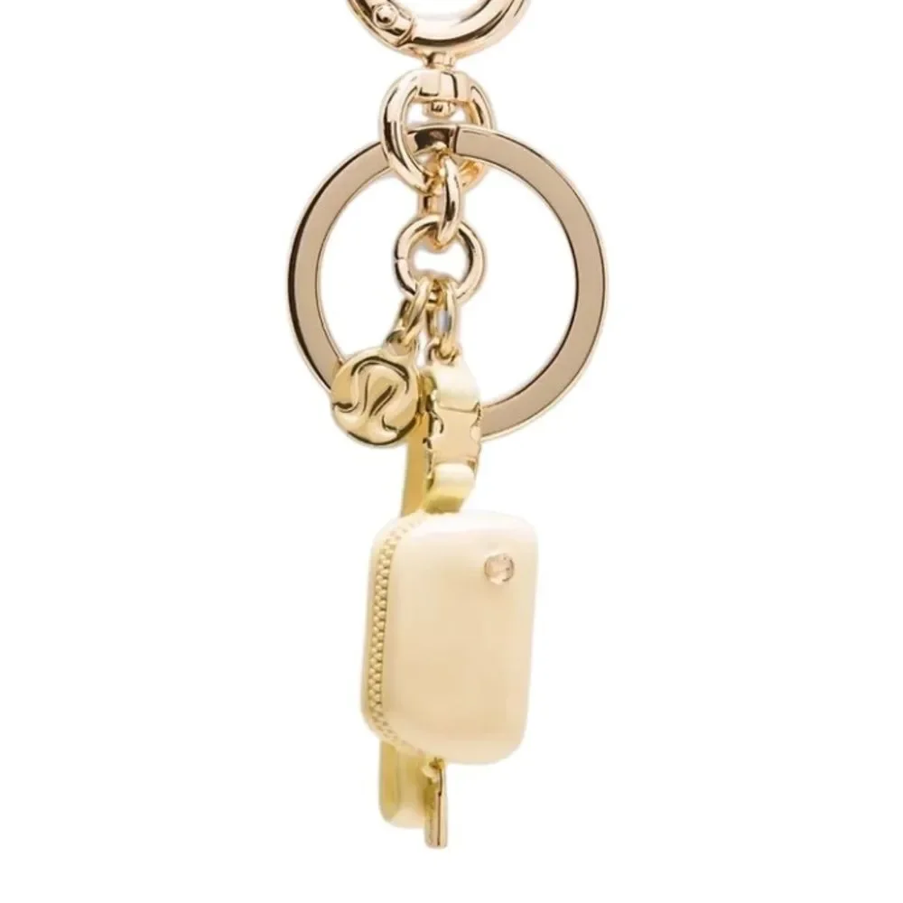 Everywhere Belt Bag Key Charm Butter Cream/Gold Key Charm